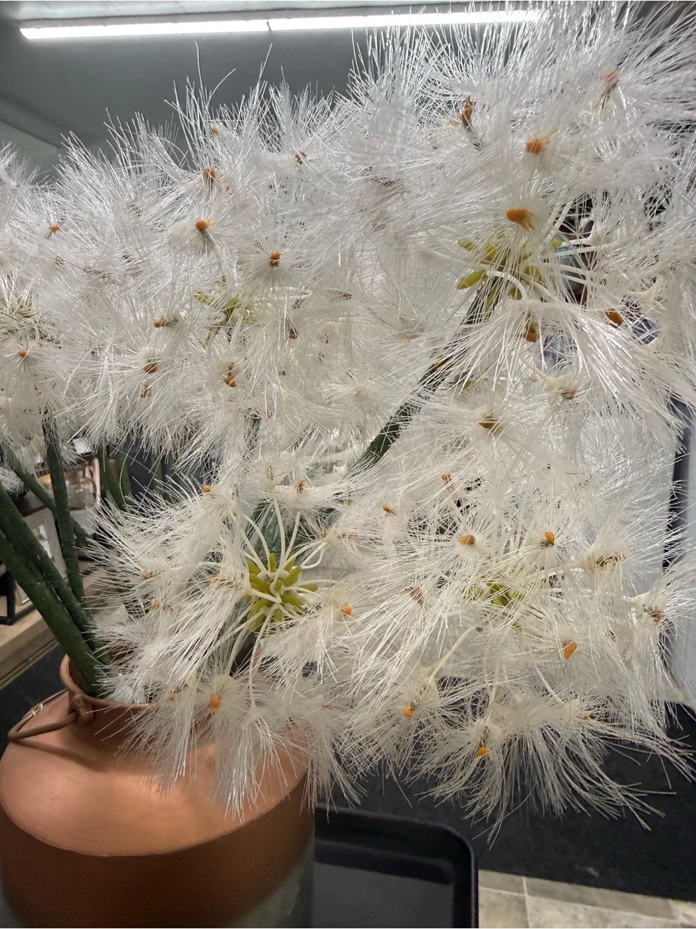 Decorative White Dandelion Stem Arrangement in Copper-Topped Metal Vase -